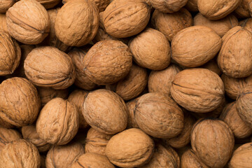 Walnuts as background, top view