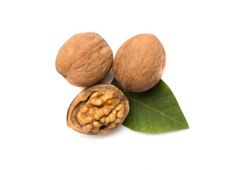 Walnuts with leaves isolated on white, top view
