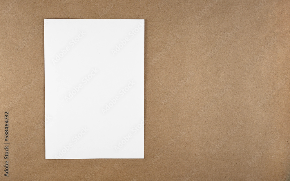 Poster A notebook in a minimal style top view isolated on brown background of recycled craft vintage paper