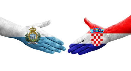 Handshake between Croatia and San Marino flags painted on hands, isolated transparent image.