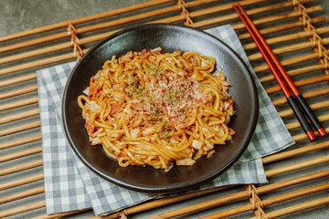 Delicious yakisoba dish on a black plate