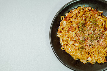 Delicious yakisoba dish on a black plate