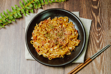 Delicious yakisoba dish on a black plate