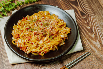 Delicious yakisoba dish on a black plate