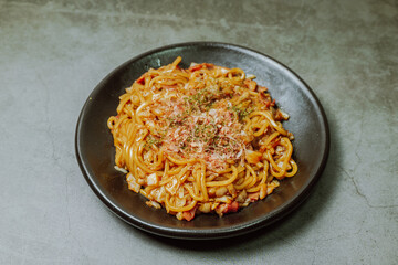 Delicious yakisoba dish on a black plate
