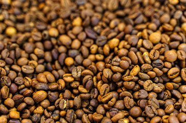 Solid background of coffee beans. Top view, close-up.