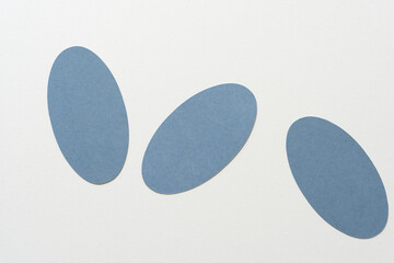 abstract composition with three oval shapes on blank paper
