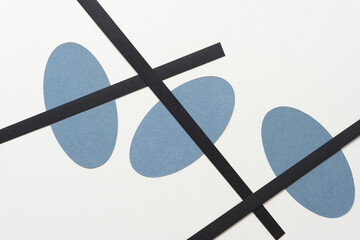 abstract composition with oval shapes and black paper stripes (diagonal and crossing lines)