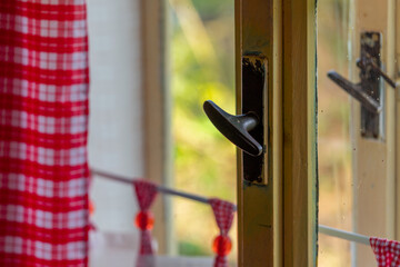 old wooden window handles, red curtains, old cottage, countryside