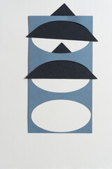 triangle tucked inside paper card stock stencil with oval shapes cutout