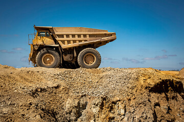 Large dump trucks in a row at a construction site 007