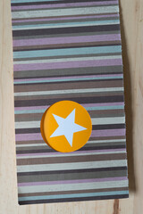 striped scrapbook paper with circle cutout and star