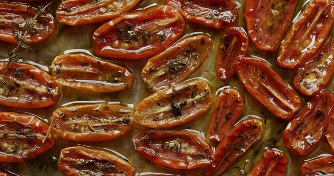 Slow roasted cherry tomato confit with garlic and thyme. Table spin.