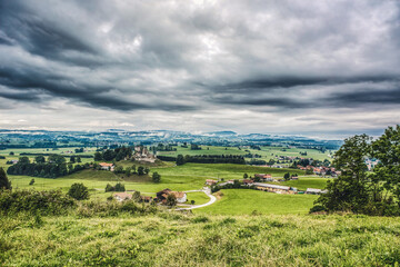 Fototapeta na wymiar View at the landscape around castle ruin sulzberg in upper allgäu, bavaria, at a cloudy day in late summer