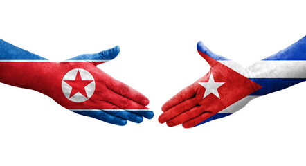 Handshake between Cuba and North Korea flags painted on hands, isolated transparent image.