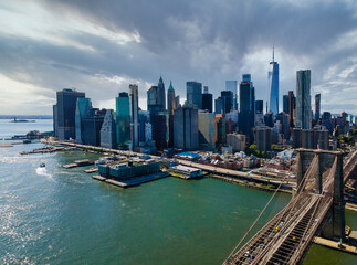 Panoramic aerial view cityscape Manhattan along East river over beautiful Brooklyn Bridge New York...