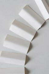 small cards folded and arranged on blank paper