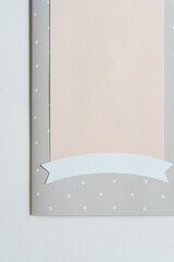banner embellishment with decorative paper backdrop or frame and space for copy