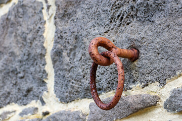 old horse tie on stone wall