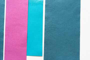 Fototapeta premium background with paper stripes in pink, blue, and white