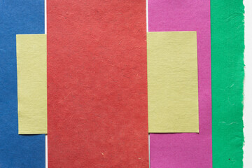 Fototapeta premium rough, textured paper background (pink, red, green)