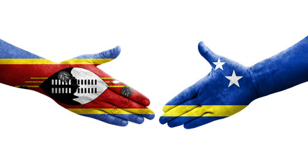 Handshake between Curacao and Eswatini flags painted on hands, isolated transparent image.