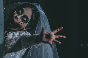 Portrait of asian woman make up ghost bride death and blood the horror is darkness scary horror...
