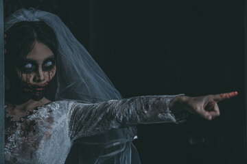 Portrait of asian woman make up ghost bride death and blood the horror is darkness scary horror...