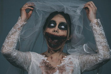 Portrait of asian woman make up ghost bride death and blood the horror is darkness scary horror...