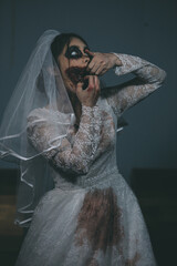 Portrait of asian woman make up ghost bride death and blood the horror is darkness scary horror...