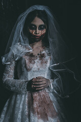 Portrait of asian woman make up ghost bride death and blood the horror is darkness scary horror...