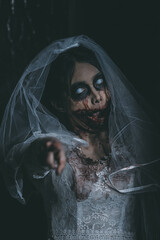Portrait of asian woman make up ghost bride death and blood the horror is darkness scary horror...
