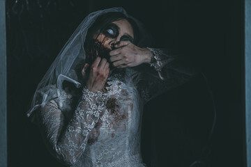 Portrait of asian woman make up ghost bride death and blood the horror is darkness scary horror...