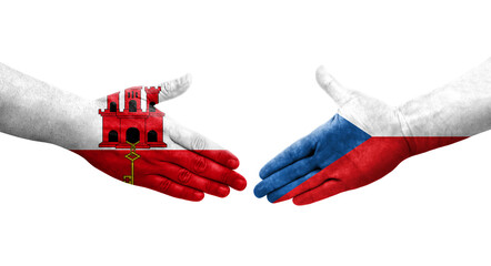 Handshake between Czechia and Gibraltar flags painted on hands, isolated transparent image.