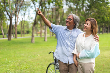 Romantic family sweet happy love senior asian couple having fun and smiling.Happy asian elderly man husband and wife hug together in park at home.insurance concept
