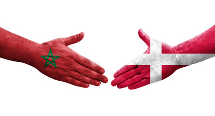 Handshake between Denmark and Morocco flags painted on hands, isolated transparent image.
