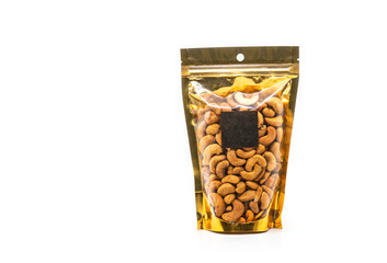 Cashew nuts in window pouch packaging with plastic, gold color packaging. Front view with a blank square black label for brand design. The image is on white background.