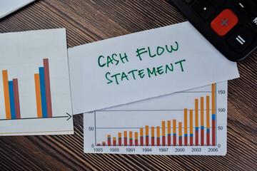 Concept of Cash Flow Statement write on sticky notes isolated on Wooden Table.