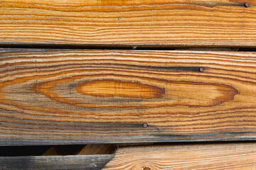 Beautiful fresh larch wooden texture background on boards