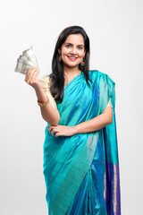 Indian woman in saree and showing money on white background.
