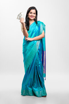 Indian Woman In Saree And Showing Money On White Background.