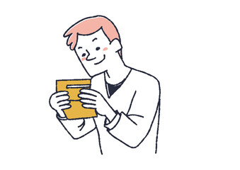 通帳の溜まった貯金を見てニンマリする男性