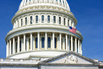 Close up of US Capitol Building dome with the American flag, Washington DC, USA