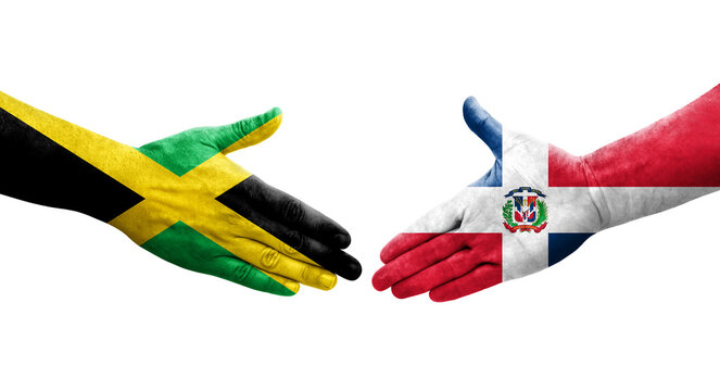Handshake between Dominican Republic and Jamaica flags painted on hands, isolated transparent image.