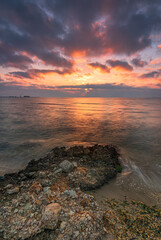 Sunrise on a rocky beach with amazing colors. God concept, end concept. Ebro Delta