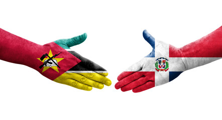 Handshake between Dominican Republic and Mozambique flags painted on hands, isolated transparent image.