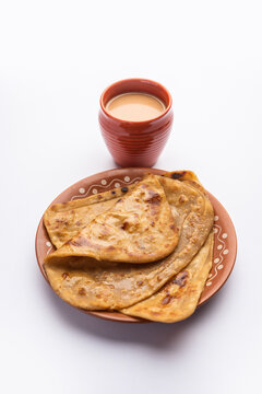 Chai Paratha - Hot Tea served with Flatbread is a traditional simple meal from India and Pakistan