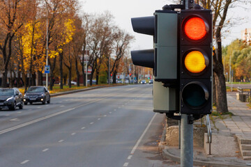 Traffic light sign on the street. Yellow and green lights