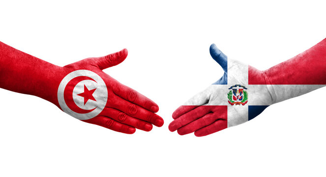 Handshake between Dominican Republic and Tunisia flags painted on hands, isolated transparent image.