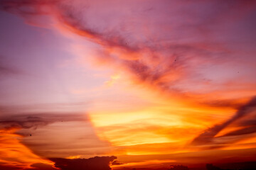 Dancing with the Sun: Majestic Sunset Clouds in the Serene Nature